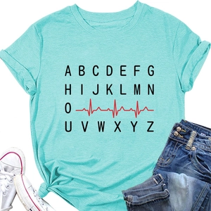 Flat lay of a mint green t-shirt with ECG heart rate graphics and casual summer outfit