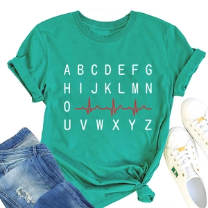 Detailed flat lay of turquoise t-shirt featuring heart rate ECG and ABC letter print