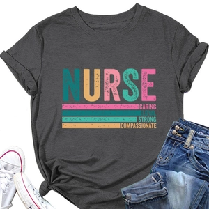 Detailed flat lay of dark gray nurse t-shirt with colorful printed caring slogan and jeans