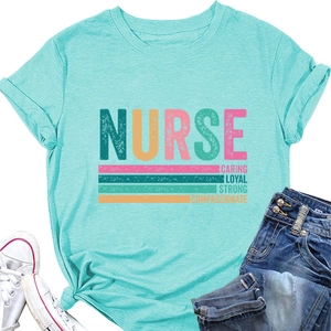 Flat lay of mint green nurse t-shirt with caring loyal strong print and denim jeans