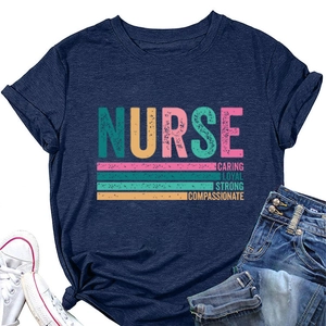 Flat lay of navy nurse t-shirt with caring loyal strong print and denim shorts