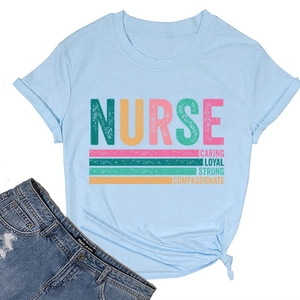 Flat lay of light blue nurse T-shirt with caring loyal strong print and denim jeans