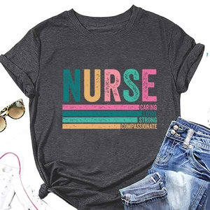 Flat lay of dark grey nurse t-shirt with Caring Loyal Strong print and fashion accessories