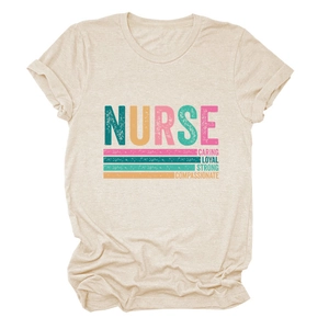 Detail of oat-colored nurse t-shirt with caring loyal strong printed typography