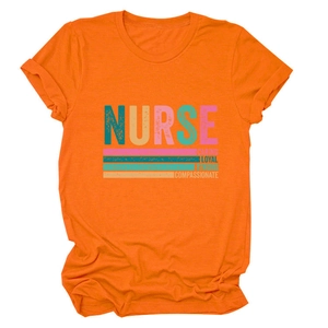 Close-up of orange cotton t-shirt with Nurse Caring Loyal Strong printed text details