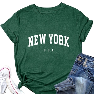 Detail of New York USA print on dark green t-shirt paired with denim and sneakers