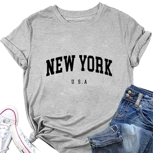 Detail of grey New York USA graphic T-shirt styled with denim jeans and white sneakers
