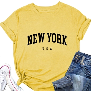 Detail of yellow New York USA graphic T-shirt with stylish front knot and crew neck