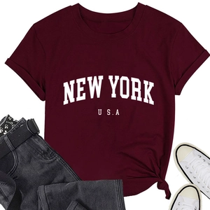 Flat lay of burgundy New York USA cotton T-shirt with casual denim and white sneakers