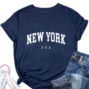 Close-up of New York USA printed text on navy blue cotton t-shirt fabric texture