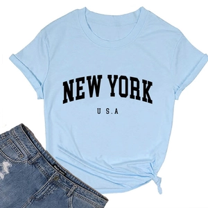 Close-up of New York USA printed tee with hem knot and distressed denim shorts set