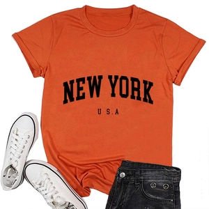 Detail of New York USA printed text on bright orange cotton crew neck t-shirt