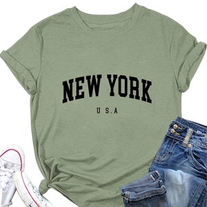 Flat lay detail of bean green cotton New York USA graphic t-shirt with jeans