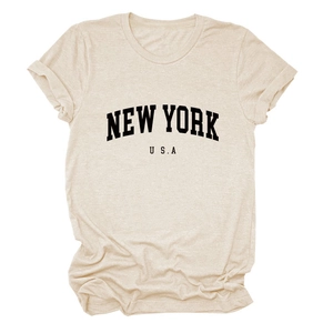 Close-up of New York USA graphic print on sand-colored crew neck cotton t-shirt