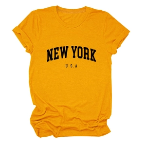 Detail of New York USA printed yellow cotton T-shirt with rolled sleeves on white background