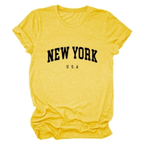 Detailed close-up of yellow New York USA graphic t-shirt with soft cotton texture