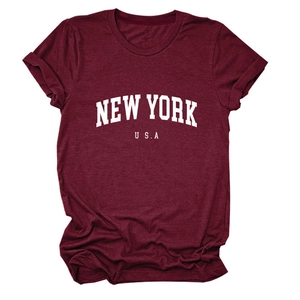 Detail of burgundy T-shirt showing rolled cuffs and New York USA graphic print