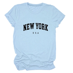Detail of light blue cotton T-shirt featuring New York USA black letter print