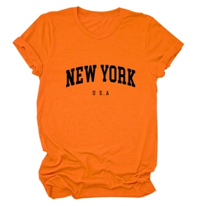 Detail of the high-quality cotton fabric and black New York USA print on orange t-shirt