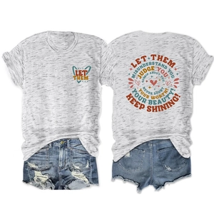 Flat lay of gray T-shirt with vintage slogan prints and distressed denim shorts