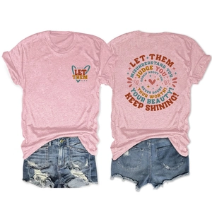 Detailed back view of a pink short sleeve T-shirt with 'Let Them' heart and circular print