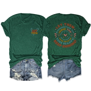 Flat lay view of dark green t-shirt with artistic text and distressed denim shorts set