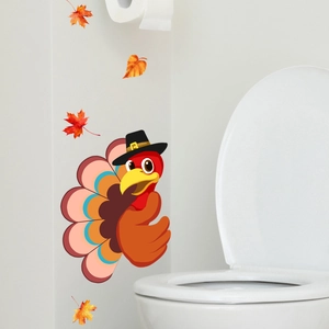 Close-up of Thanksgiving turkey wall stickers with maple leaves on a white bathroom wall