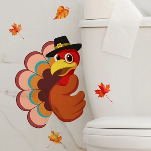 Cartoon turkey and maple leaf wall decals on a white bathroom wall for Thanksgiving decor