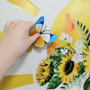 Detail showing 3D blue and yellow butterfly wall stickers with double-layered wings