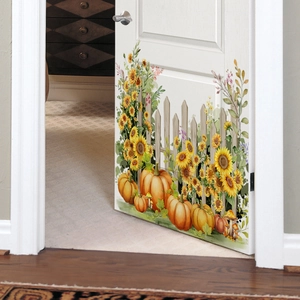 Detail of autumn wall stickers featuring sunflowers and pumpkins on a white door