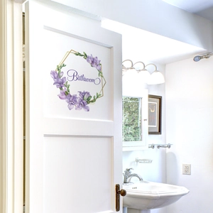 Self-adhesive floral bathroom door sticker with purple wreath and gold hexagon frame