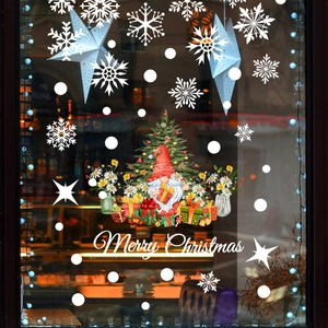 Christmas window stickers set featuring gnome with tree, Merry Christmas text and snowflakes