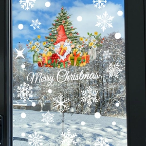 Christmas window stickers featuring Santa Claus and snowflakes against a winter sky