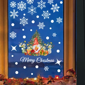 Detail of Christmas window gnome decal with Merry Christmas text on glass window pane
