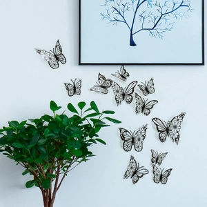 Set of 12 black 3D butterfly wall stickers with intricate floral patterns for home decor