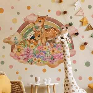 Detailed view of cartoon deer, rainbow, and floral wall stickers in a warm nursery room