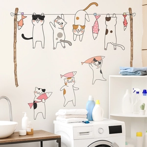 Cartoon cat and fish wall stickers in a laundry room scene for home wall decoration