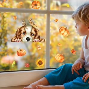 Child looking at autumn window decals featuring dogs, pumpkins, and sunflowers