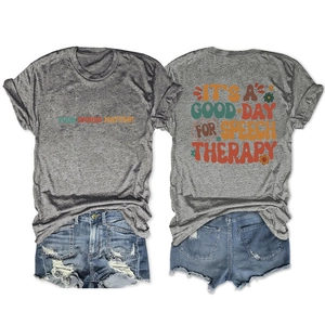 Front and back detail of a gray heather T-shirt with vintage colorful text and denim shorts
