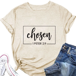 Detail of beige cotton T-shirt with 'chosen' print, styled with jeans and white sneakers