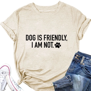 Detail of apricot crew neck T-shirt featuring 'DOG IS FRIENDLY' print and cotton texture