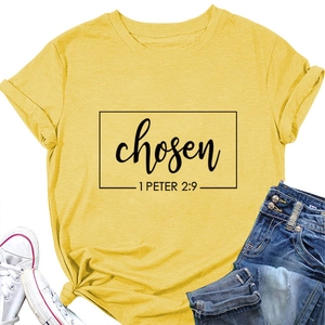 Flat lay of yellow cotton T-shirt with chosen 1 Peter 2:9 print and denim jeans