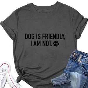 Flat lay of grey Dog Is Friendly t-shirt paired with denim shorts and white sneakers