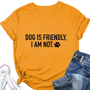Flat lay of an orange cotton T-shirt with 'DOG IS FRIENDLY' print and denim jeans