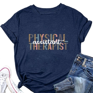 Flat lay of navy blue Physical Therapist T-shirt with leopard print text and denim shorts
