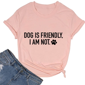 Flat lay of pink cotton T-shirt with humorous dog slogan and side knot detail