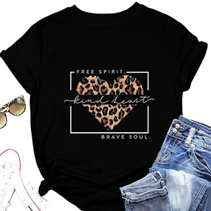 Flat lay of black cotton T-shirt with leopard heart print and casual summer accessories