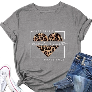 Flat lay of grey t-shirt with leopard heart print, styled with jeans and sneakers