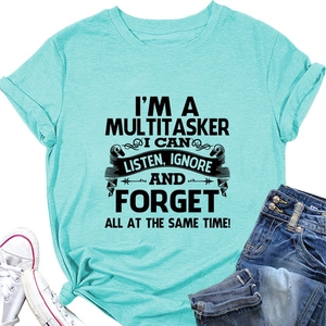 Detail of mint green multitasker slogan T-shirt with stylish knot and denim pairing