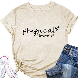 Flat lay of a light beige physical therapist graphic tee with denim and sneakers